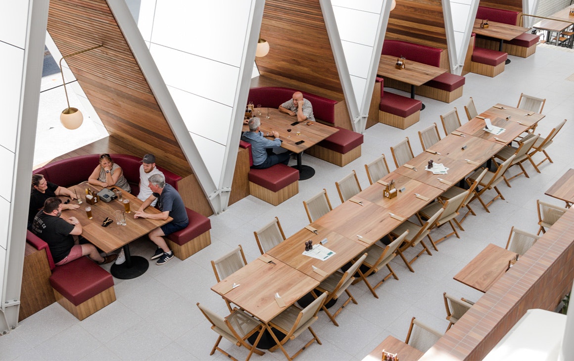 booths underneath a frame style structures